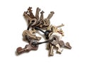 Bunch of old, small keys to lost locks on a white background