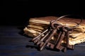 Bunch of old vintage keys with books on table, space for text Royalty Free Stock Photo