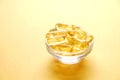 Yellow nutritional supplement pills full of Omega 3 fatty acids. Royalty Free Stock Photo