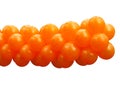 A bunch orange party balloons isolated Royalty Free Stock Photo