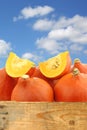 Bunch of orange pumpkins in a wooden crate Royalty Free Stock Photo