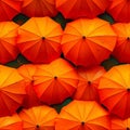 A bunch of orange umbrellas with water droplets on them Royalty Free Stock Photo