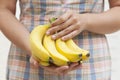 Bunch of organic banana in hands