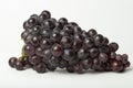 Bunch of organic blue-black grapes isolated on white background Royalty Free Stock Photo