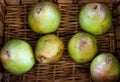 A bunch of organic pears in wooden box, natural light Royalty Free Stock Photo