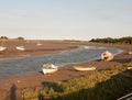 a bunch of parked moored boats on the beach of stream river maldon black water essex Royalty Free Stock Photo