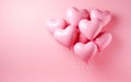 Bunch of pastel pink heart shaped latex balloons isolated on pink background Royalty Free Stock Photo