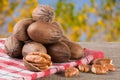 A bunch of pecan nuts on a wooden background Royalty Free Stock Photo