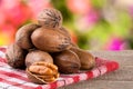 A bunch of pecan nuts on a wooden background Royalty Free Stock Photo