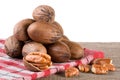 A bunch of pecan nuts on a wooden background Royalty Free Stock Photo