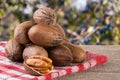 A bunch of pecan nuts on a wooden background Royalty Free Stock Photo