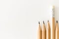 Bunch of pencils one with eraser up standing out Royalty Free Stock Photo