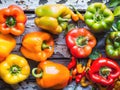 A bunch of peppers are displayed on a wooden table Royalty Free Stock Photo