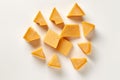 A bunch of pieces of cheese on a white background, created by Generative AI