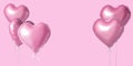 Bunch of pink color heart shaped foil balloons isolated on bright background. Minimal love concept Royalty Free Stock Photo