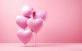 Bunch of pink glossy heart shaped latex balloons on pastel pink background Royalty Free Stock Photo