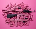 a bunch of pink guns laying on top of each other Royalty Free Stock Photo