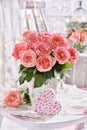 Bunch of pink roses and a heart decor in shabby chic style Royalty Free Stock Photo