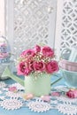 Bunch of pink roses in a mint watering can Royalty Free Stock Photo