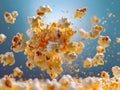 A bunch of popcorn falling into the air with a blue sky in the background Royalty Free Stock Photo