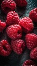 a bunch of raspberries sitting on top of a table covered in water droplets on a black surface with drops of water on the surface