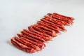 Dried sausages on a light background. Selective focus Royalty Free Stock Photo