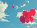 Bunch of red ballons on a blue sky Royalty Free Stock Photo