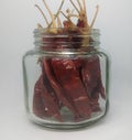 Bunch of red chillies filled in a glass box