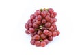 Bunch of red grapes , fresh with water drops. on white Royalty Free Stock Photo