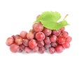 Bunch of red grapes with green leaf isolated on white Royalty Free Stock Photo