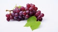 bunch of red grapes with green leaf isolated on a white background Royalty Free Stock Photo