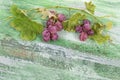 Bunch of red grapes on old cracked green paint wooden table