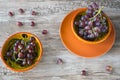 Bunch of red grapes in orange bowl, against wooden background Royalty Free Stock Photo