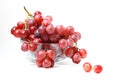 A bunch of red grapes in transparent bowl