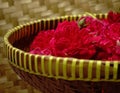 Bunch of red roses on a bamboo basket