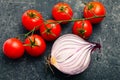 Bunch red tomatoes and red onion Royalty Free Stock Photo