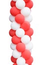 A bunch of red and white balloons in the shape of a column isolated Royalty Free Stock Photo