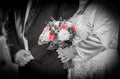 Bunch of red and white roses in the bridesmaid hand Royalty Free Stock Photo