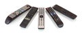 Bunch of remote controls for TV , Blu Ray player, satellite receiver, home cinema amplifier isolated on white background.