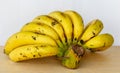 Bunch Ripe bananas lay on the wooden floor. Royalty Free Stock Photo