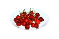 A bunch of ripe cherries on a white plate. Fresh red berries contrast with the Royalty Free Stock Photo