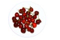 A bunch of ripe cherries on a white plate. Fresh red berries contrast with the Royalty Free Stock Photo