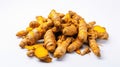 Bunch of ripe dried organic turmeric roots laid in composition on white background. Curcuma at table counter. Close up, flat lay,