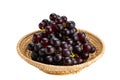 Bunch of ripe purple grapes in bamboo basket isolated on white background Royalty Free Stock Photo