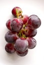 Bunch of ripe purple and red grapes isolated on white background Royalty Free Stock Photo