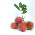 A bunch of ripe rambutan fruits with leaves isolated on white background. Royalty Free Stock Photo