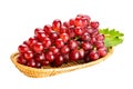 Bunch of ripe red grapes, Crimson Seedless Grapes, with green leaf in bamboo tray