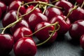 A bunch of ripe sweet cherries with stems and leaves. Royalty Free Stock Photo