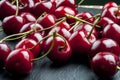 A bunch of ripe sweet cherries with stems and leaves. Royalty Free Stock Photo