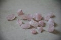bunch of rosequartz stones on the floor Royalty Free Stock Photo